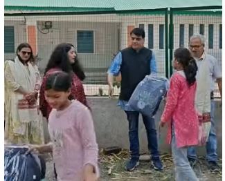 Children trying out their new notebooks and pencils